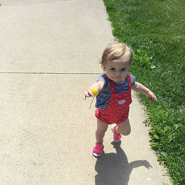 My daughter bringing her Grandma a "flower" at Bergfeld Pond